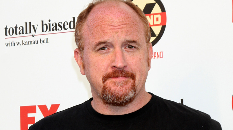 Louis CK smirking