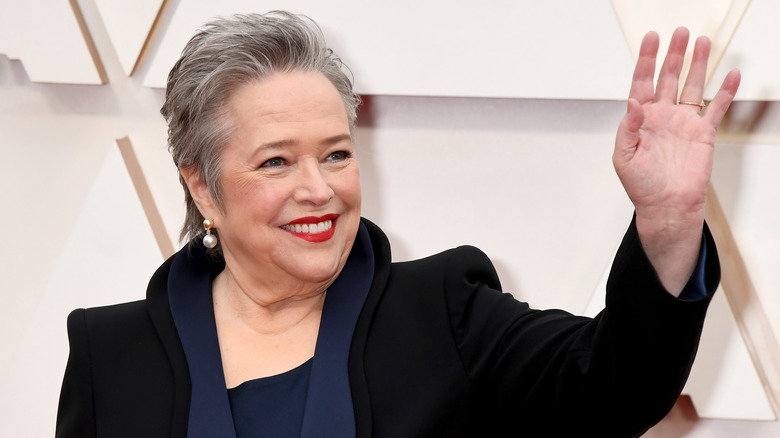 Kathy Bates smiles and waves