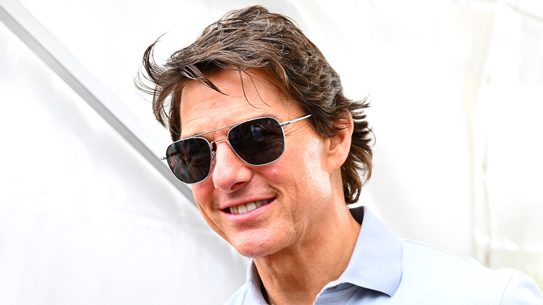 Tom Cruise smiling and wearing sunglasses