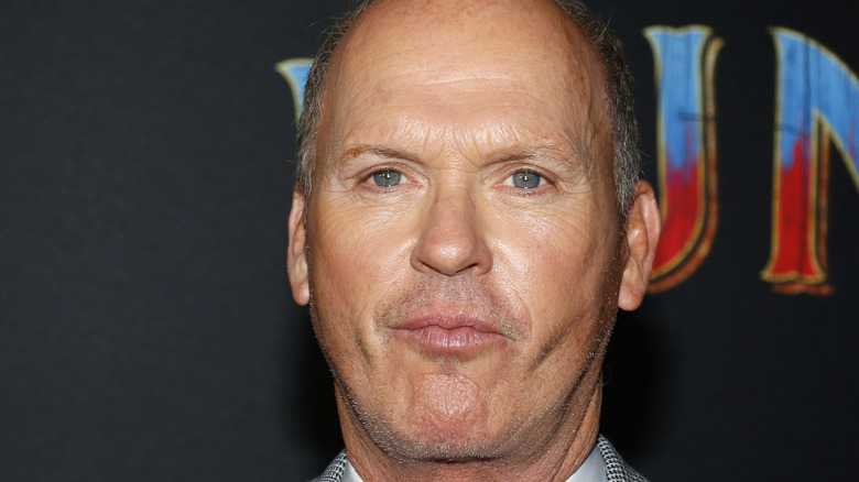 Michael Keaton sucking in cheeks