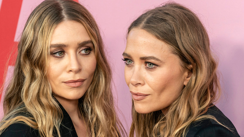 Mary-Kate and Ashley pose for pictures at a red carpet event