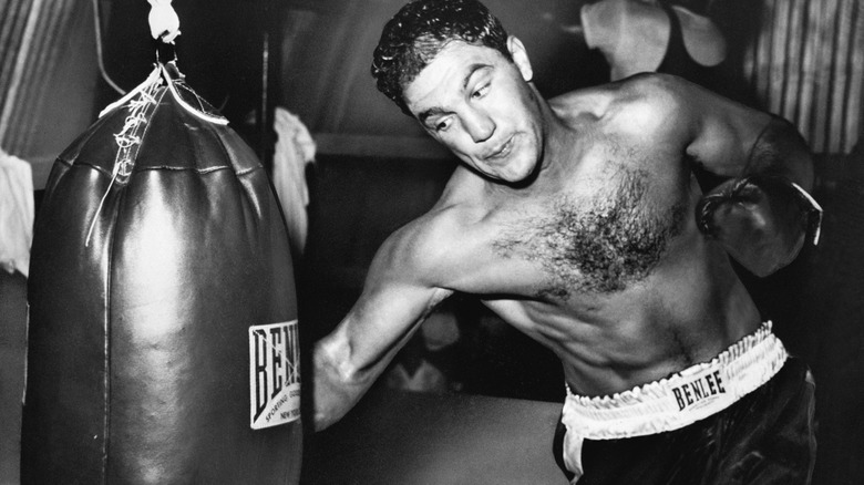 Rocky Marciano practices with punching bag