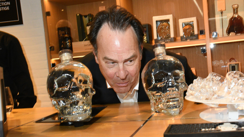 Dan Aykroyd with skull vodka