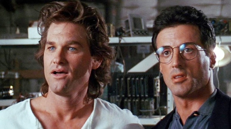 Kurt Russell and Sylvester Stallone looking for clues