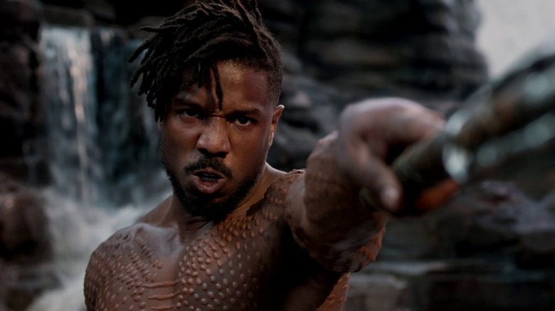 Killmonger holding weapon