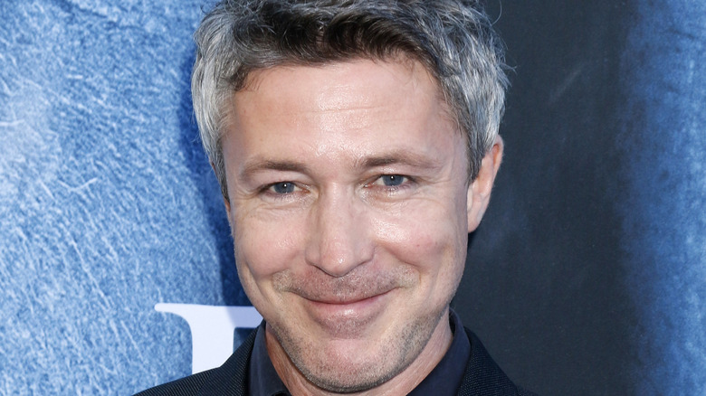 Aiden Gillen smiling