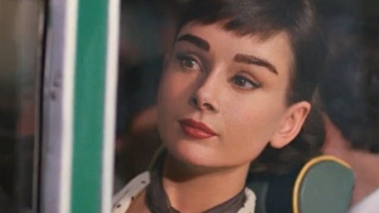 CGI Audrey Hepburn on a bus