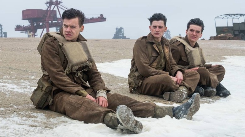 Soldiers sitting on beach Dunkirk