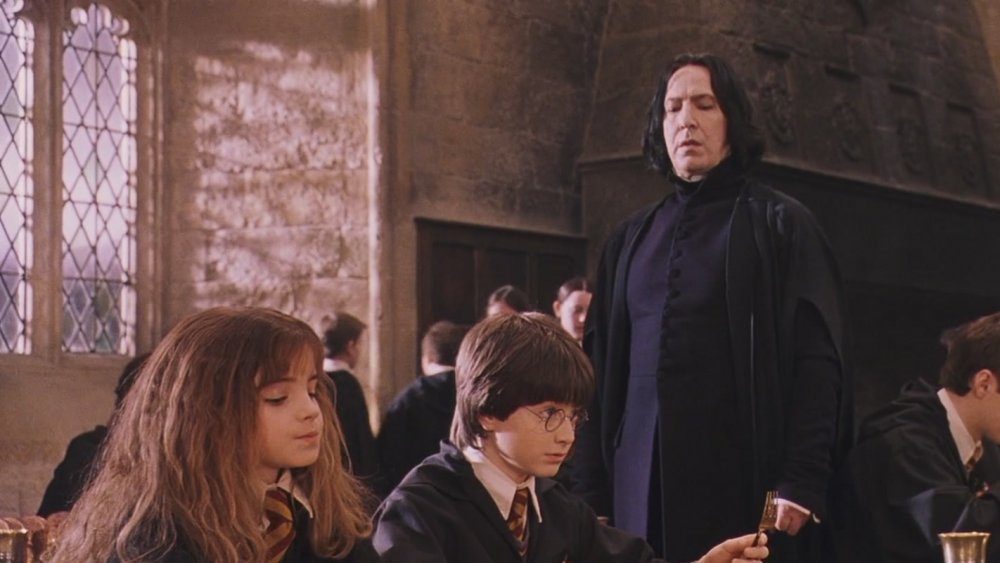 Snape looks at Harry and Hermione