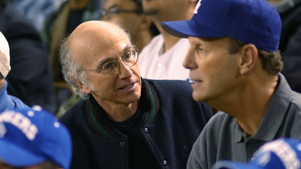 Larry David smirks at Bob Einstein