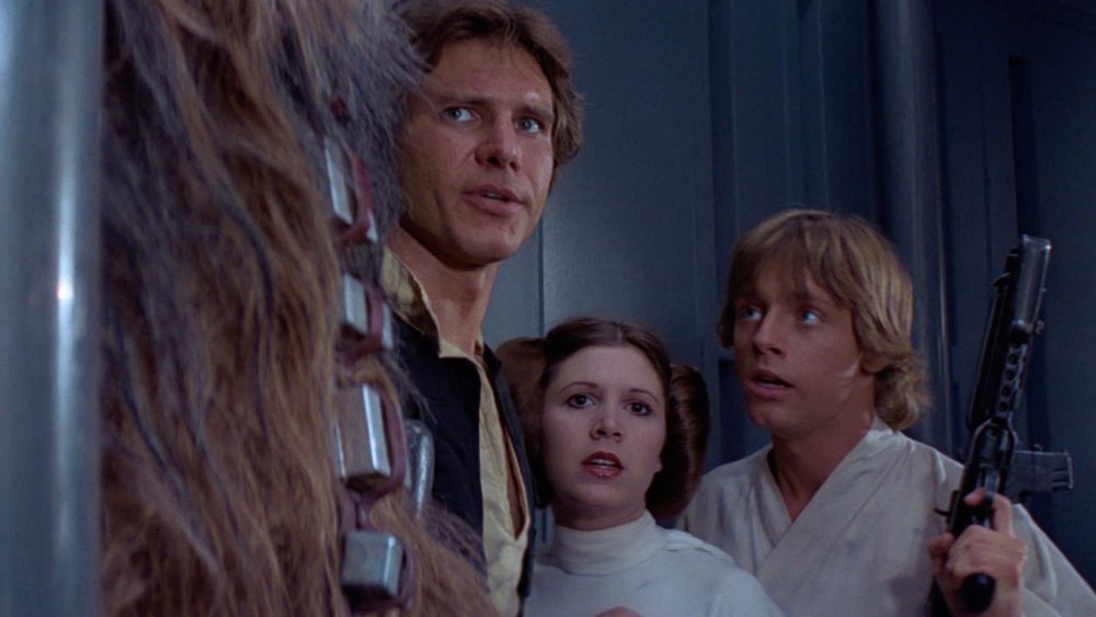 Luke, Han, and Leia around corner