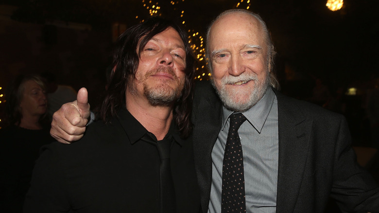 Norman Reedus and Scott Wilson embrace