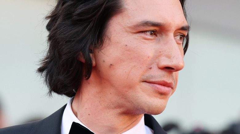 Adam Driver poses at ceremony