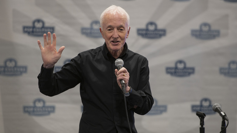 Anthony Daniels waves to fans