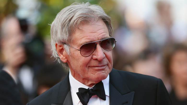 Harrison Ford wears sunglasses at premiere