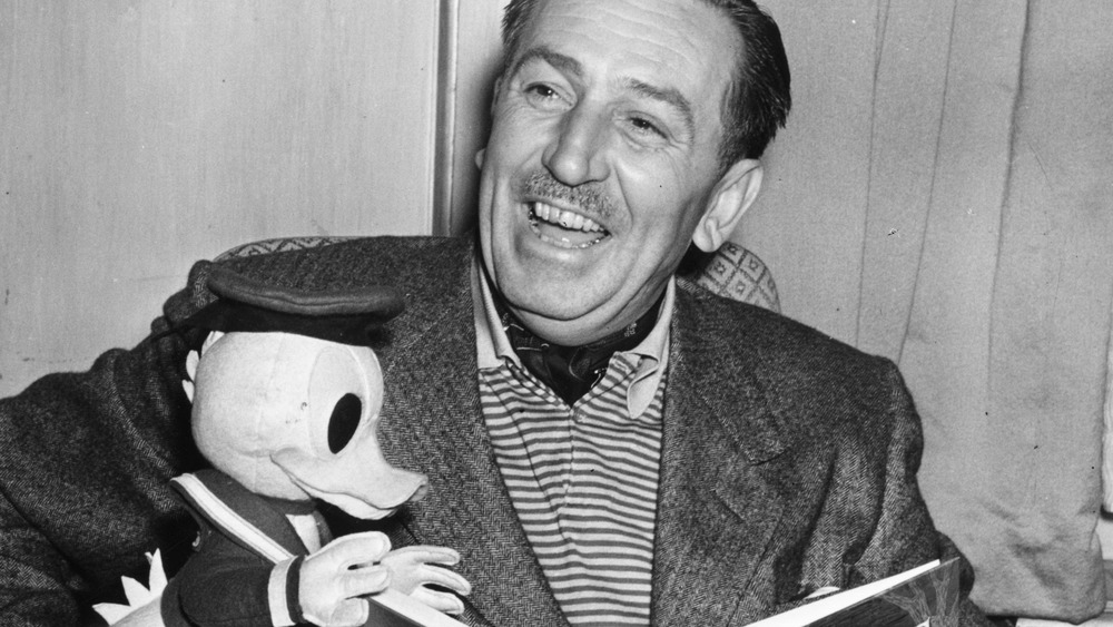 Walt Disney reading to Donald Duck