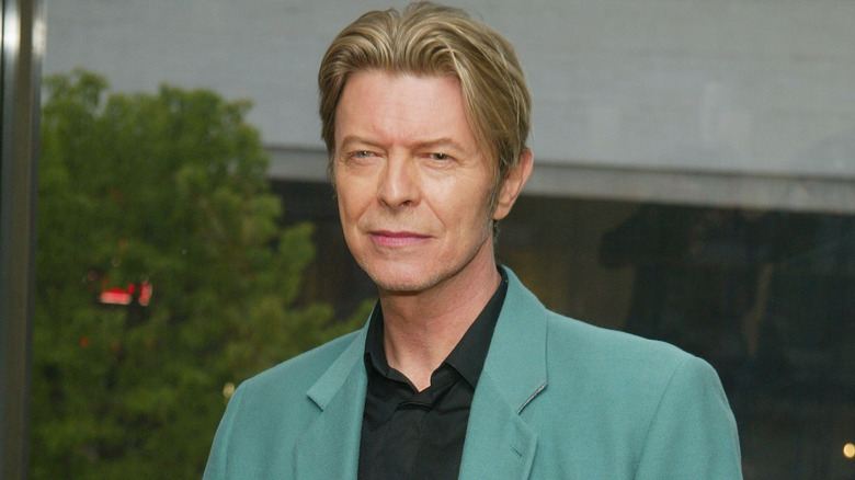 David Bowie wearing teal suit