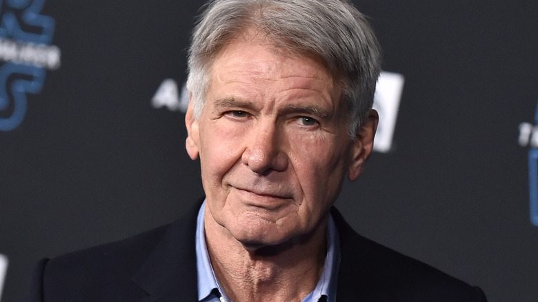 Harrison Ford wearing black suit