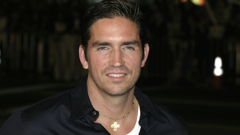 Jim Caviezel wearing cross necklace