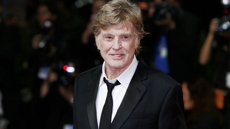 Robert Redford wearing black suit