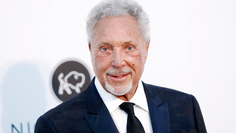 Tom Jones wearing blue suit