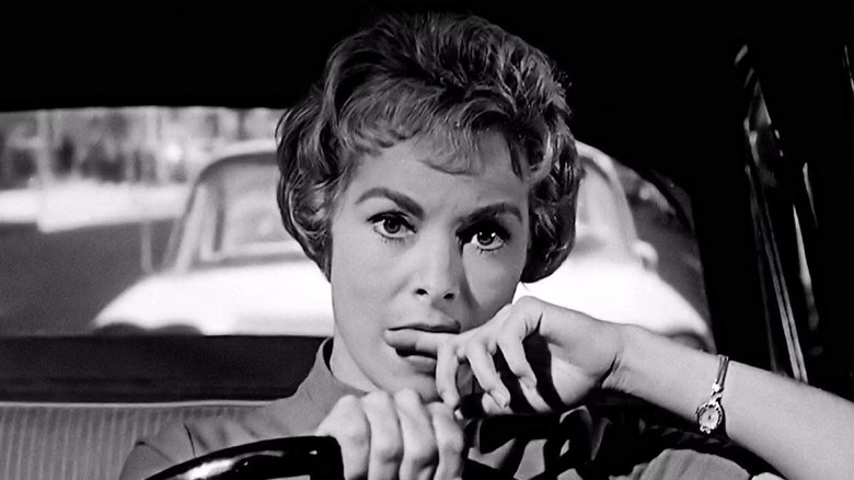 Marion Crane driving and biting her finger