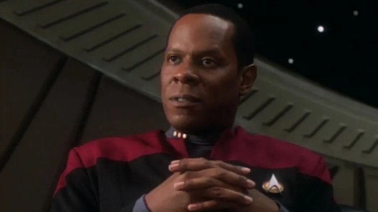 Sisko hands folded