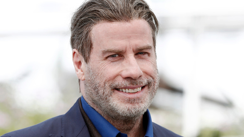 John Travolta smiles