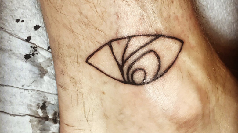 VFD eye tattoo on ankle