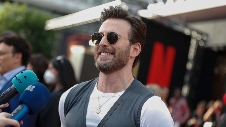 Chris Evans in sunglasses smiling