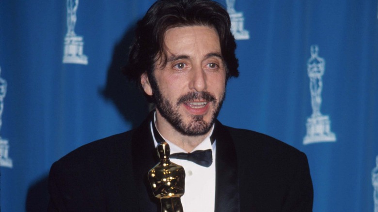 Al Pacino takes a photo with his Oscar.