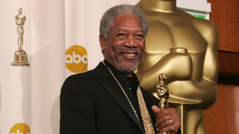 Morgan Freeman strikes a pose with his Oscar.