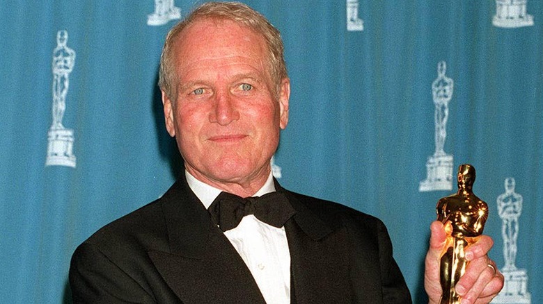 Paul Newman holds his Oscar.