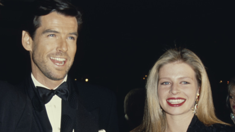 Pierce Brosnan and Charlotte Harris smile