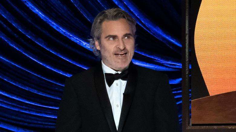 Joaquin Phoenix laughs in tuxedo