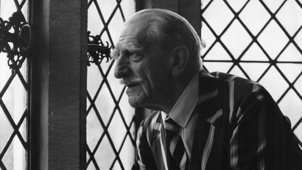 C. Aubrey Smith looking out window