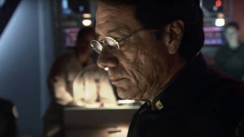 Captain Adama looks at his console