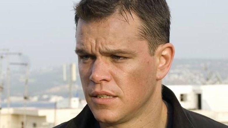 Matt Damon looks left