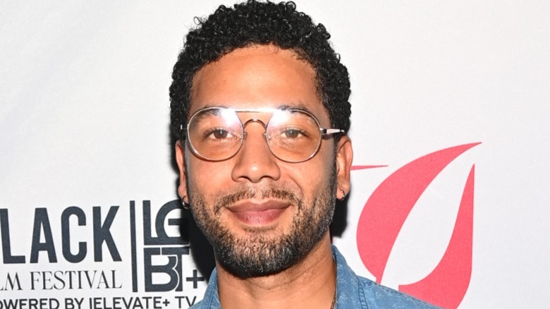 Jussie Smollett smiling in glasses