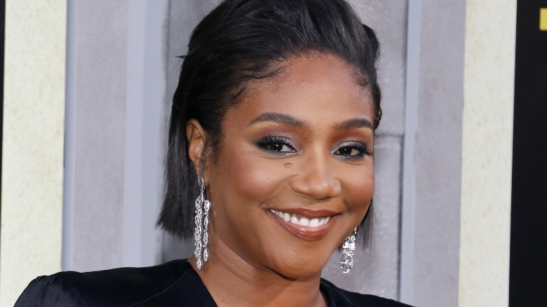 Tiffany Haddish smiling on red carpet