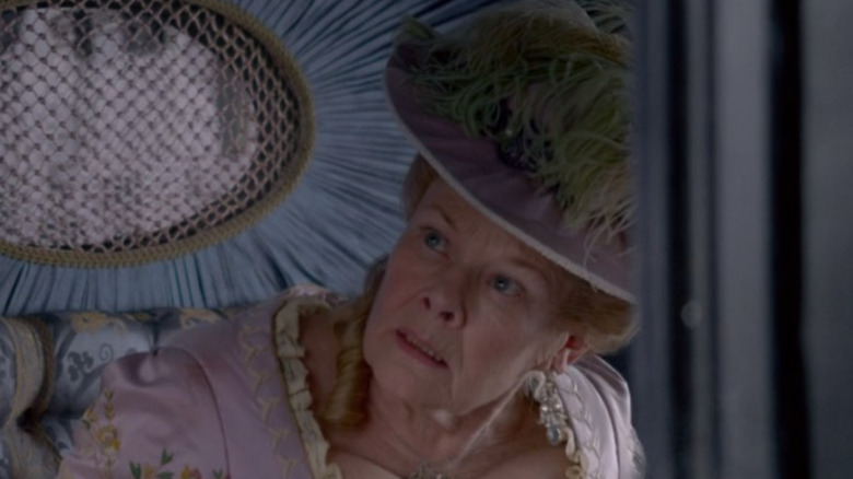 Judi Dench in purple carriage