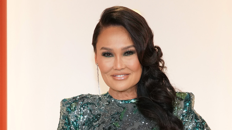 Tia Carrere wears an evening dress