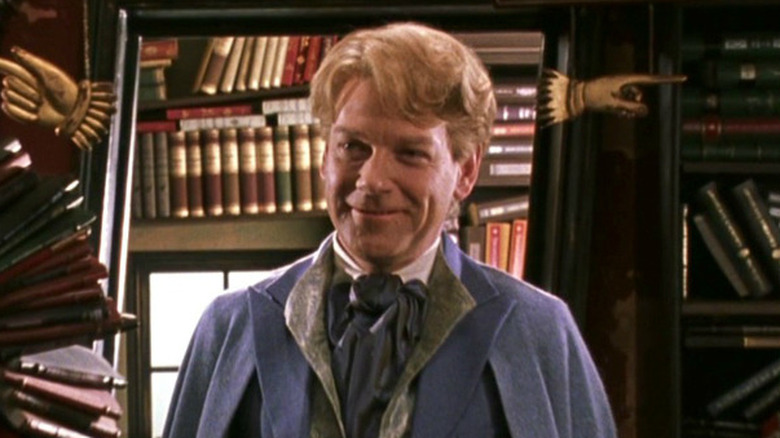 Lockhart smiles in front of mirror