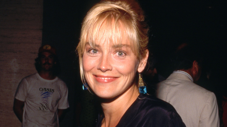 Sharon Stone smiling with bangs