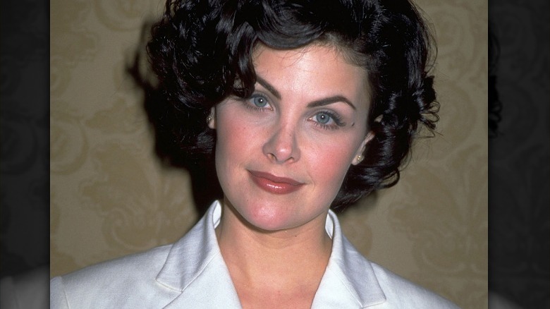 Sherilyn Fenn smiling in white