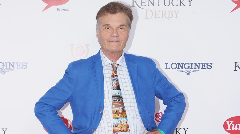 Fred Willard stands with hands on hips