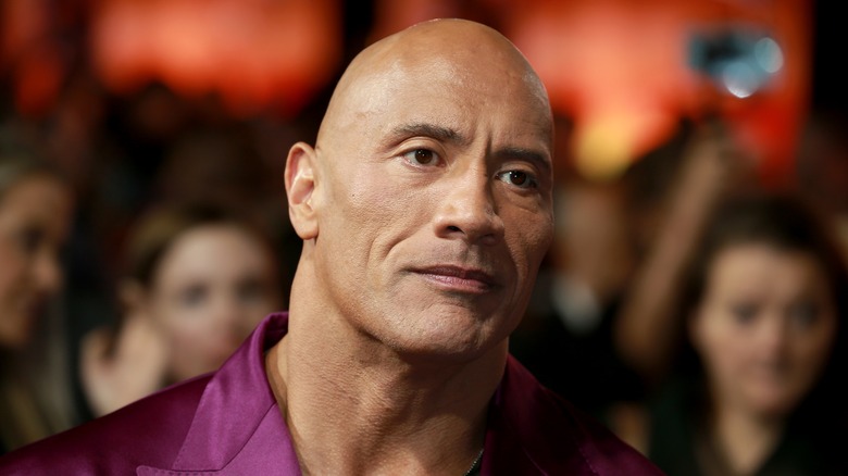 Dwayne Johnson wearing purple shirt