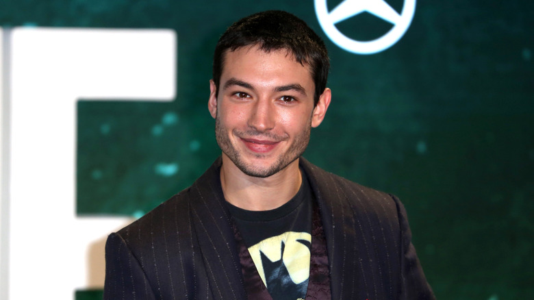 Ezra Miller wearing pinstriped blazer