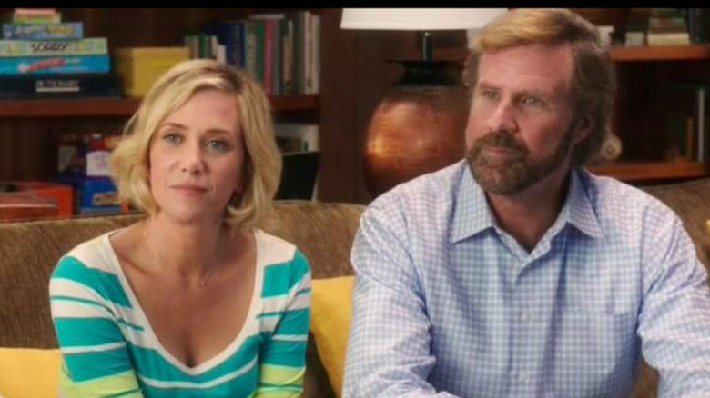 Kristen Wiig and Will Ferrell sit next to each other