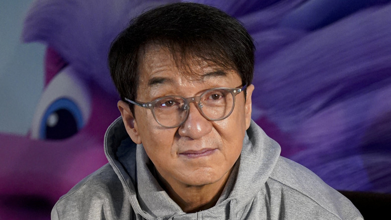 Jackie Chan wearing glasses